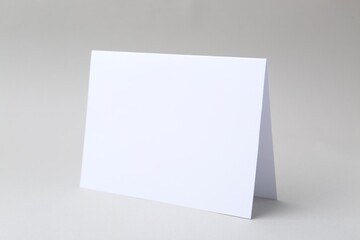 One blank greeting card on light background