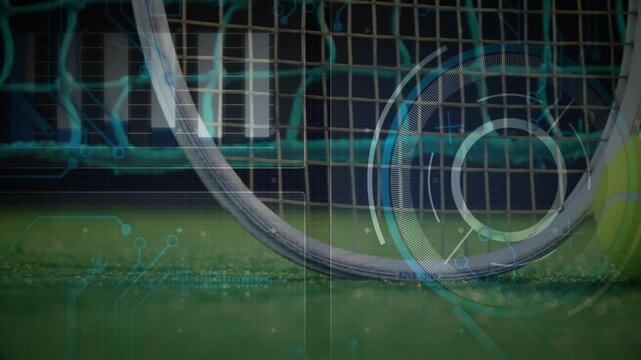 White curved field hockey stick resting on green turf, displaying futuristic HUD graphics