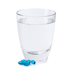 Collagen capsules and glass of water isolated on white