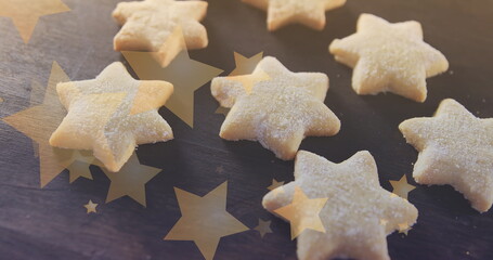Fototapeta premium Image of stars floating over homemade cookies