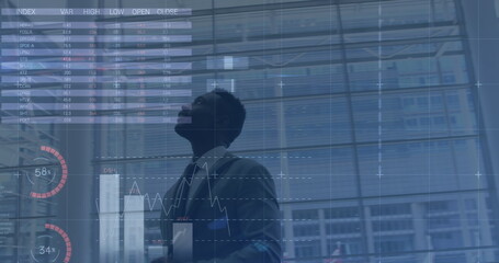 Image of data processing over african american businessman walking