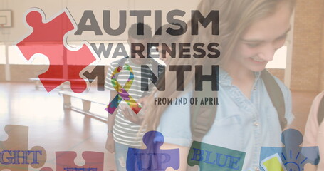 Image of autism awareness month text over diverse schoolchildren using tablet