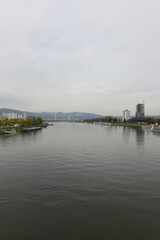 Fototapeta premium A riverside embankment in Linz, the river Danube, Austria 