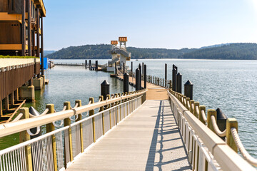 The bridge ramp from Independence Point accessing the world's longest floating boardwalk around the marina at the lakefront town of Coeur d'Alene, Idaho, USA.