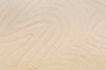 Textured beach sand as background, top view