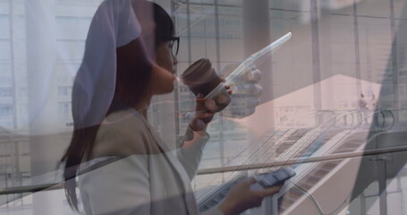 Image of men using tablet over asian businesswomen