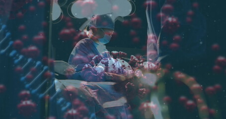 Operating surgeon performing incision with instruments in operating room, with coronavirus models