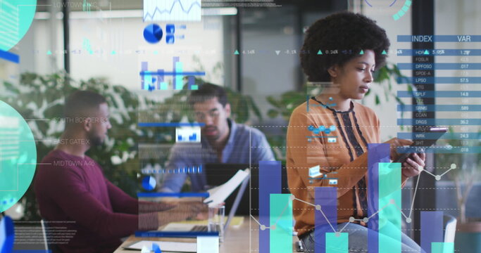 Statistical data processing against thoughtful african american woman using digital tablet at office