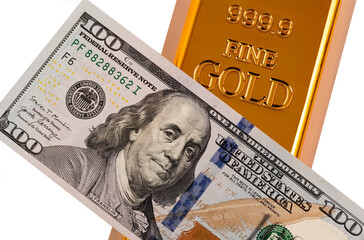 A $100 US bill and a 999 fineness gold bar