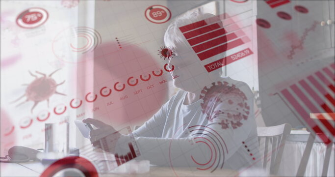 Image of financial data and virus cells over sad biracial senior woman using smartphone - Powered by Adobe