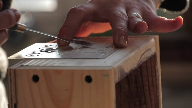 Using a decorative stencil and texture paste to create intricate wood designs
