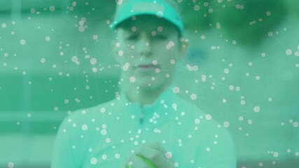 Female tennis player holding tennis ball on court, featuring overlaid tech network connecting nodes - Powered by Adobe