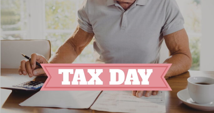 Image of tax day text over caucasian man doing paperwork - Powered by Adobe