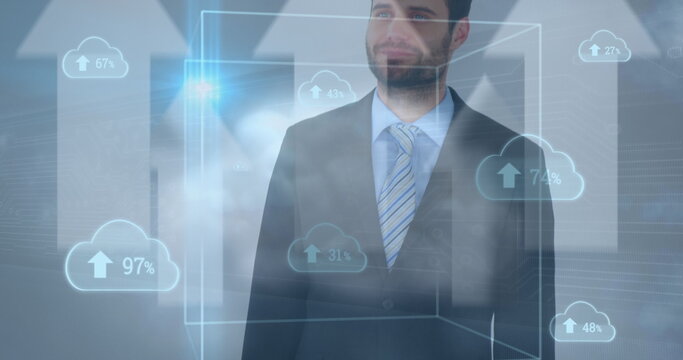 Multiple cloud icons with increasing percentage against caucasian businessman smiling