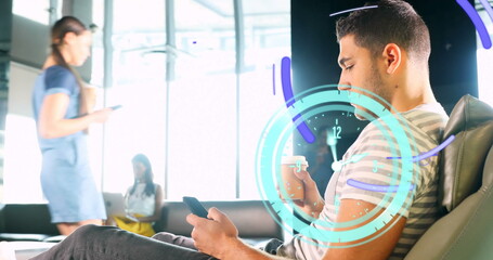 Image of clock moving over biracial businessman using smartphone