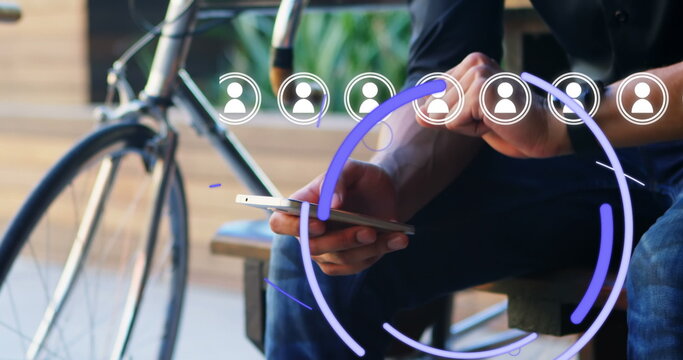 Image of media icons and eye over biracial businessman using smartphone