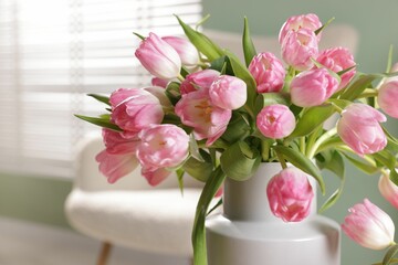 Bouquet of beautiful tulips in vase indoors, closeup