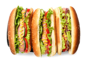 Tasty hot dogs with vegetables isolated on white, top view