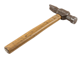 Wellworn hammer resting on black background