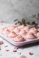 Close up of Pink Strawberry Cupcakes in a Pink Muffin Tin