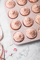 Top View of Pink Strawberry Cupcakes in a Pink Muffin Tin