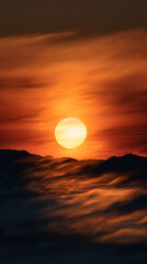 Fototapeta premium Golden sun rises over the misty mountains, casting an ethereal glow on the swirling fog, painting the sky with vibrant hues of orange and red at dawn's early light.
