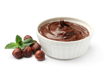 Chocolate hazelnut spread in bowl, nuts and mint isolated on white