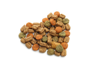 Heart made of dry pet food isolated on white