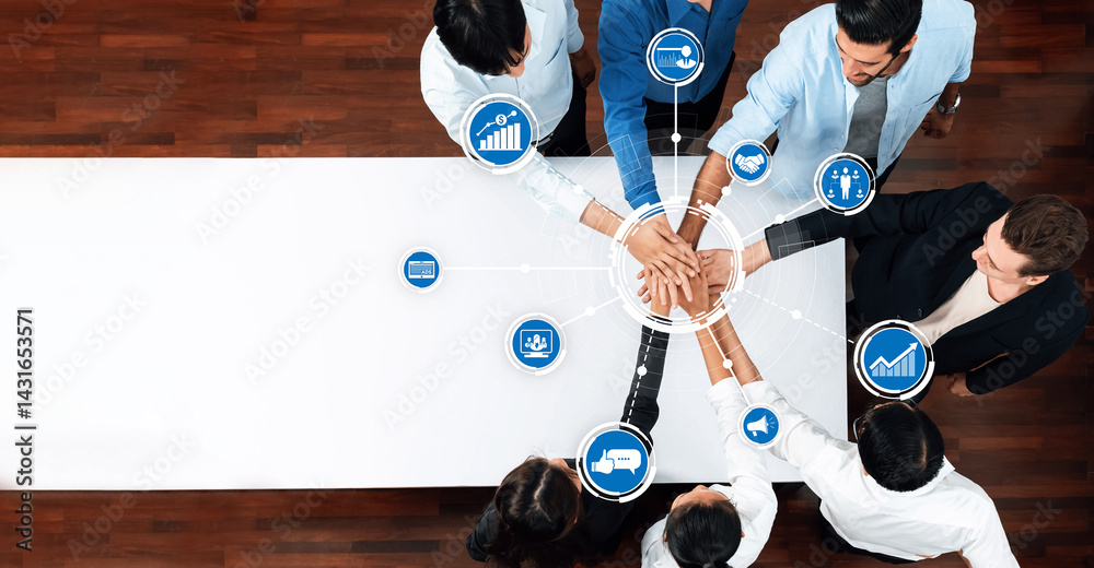 Aufkleber aerial view of diverse professionals joining hands around a table, showcasing teamwork with business