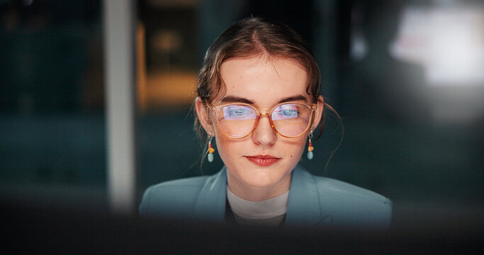 Glasses, reading or businesswoman with computer, review or news for accounting deadline or funding solution. Bookkeeping, finance or financial advisor on technology in night for research or overtime