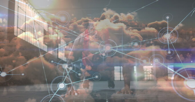 Image of data processing over clouds and african american sportsman doing push ups - Powered by Adobe