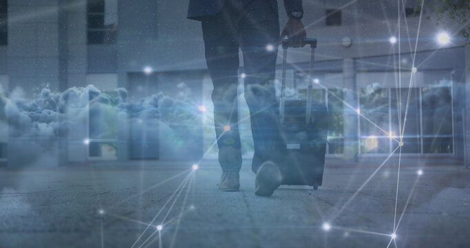 Image of data processing over clouds and biracial businessman walking