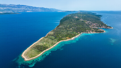 Aerial view of Cape Lun, the northernmost point of Pag Island, Croatia. Featuring the ancient Olive Gardens of Lun with thousands of centuries-old olive trees, rocky coastline, and stunning Adriatic