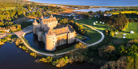 Most beautiful medieval french castles - amazing chateau de Suscinio (Susinio) over sunset in Brittany, France scenic places.  aerial high angle panoramic view