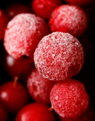 A close up of a bunch of red berries with a white powder on them