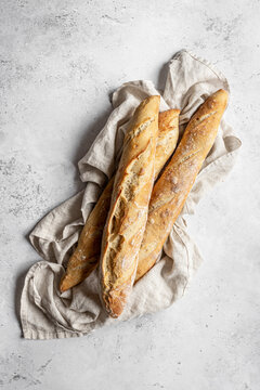 French baguettes on a white surface