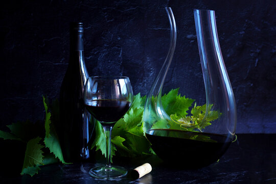 Decanting red wine concept with swan style decanter that is suitable for bold wine such as shiraz cabernet shown.