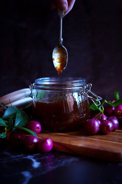 Australian Lilly Pilly Riberry Jam against a black background.