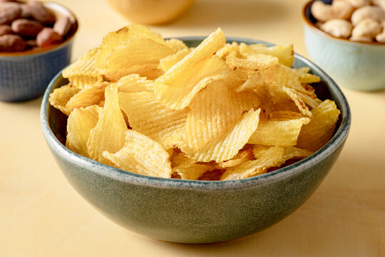 Bowl that holds golden and crispy chips fries.