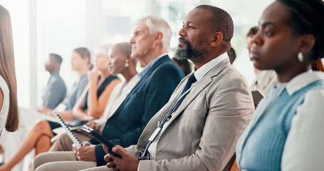 Tablet, meeting and business man at conference for seminar schedule, economic forum and audience. Finance workshop, market research report and tradeshow event with people at convention expo for plan