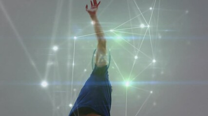 Man raising tennis racket indoors, showcasing glowing network lines and lens flares for tech theme - Powered by Adobe