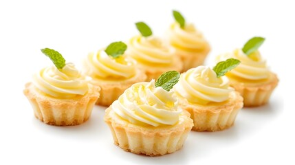 Mini lemon tartlets topped with cream and zest