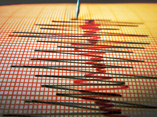              Seismograph and earthquake. A seismograph that records the seismic activity of an earthquake.                                                 