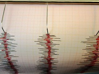              Seismograph and earthquake. A seismograph that records the seismic activity of an earthquake.                                                 