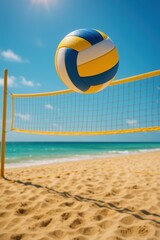 Beach volleyball action: vibrant ball in mid-air over sandy shoreline with clear blue sky
