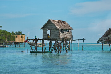 Island of Borneo. Malaysia. November 30, 2018. Sea Gypsy village on a sandy coral reef island. The main trade of local residents is fishing and sea Souvenirs.