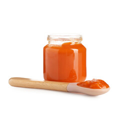 Baby food. Tasty puree in glass jar and spoon isolated on white