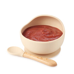 Baby food. Tasty puree in bowl and spoon isolated on white
