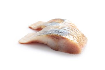 Pieces of delicious herring isolated on white