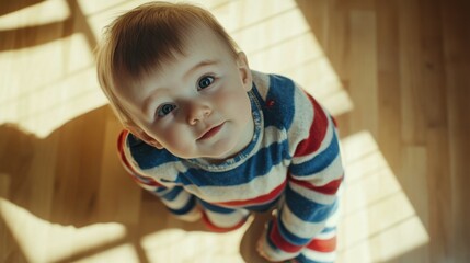 Cute baby crawling on the floor top view